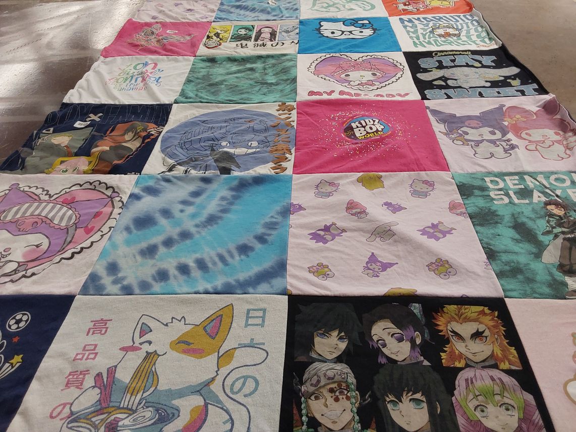 T-shirt quilt with anime, k-pop themes by Leatha from NC