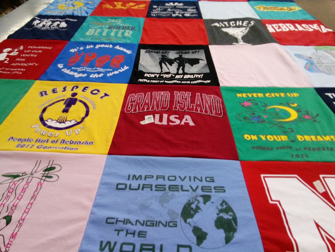 T-shirt quilt with advocacy, community themes by JULIE from NE