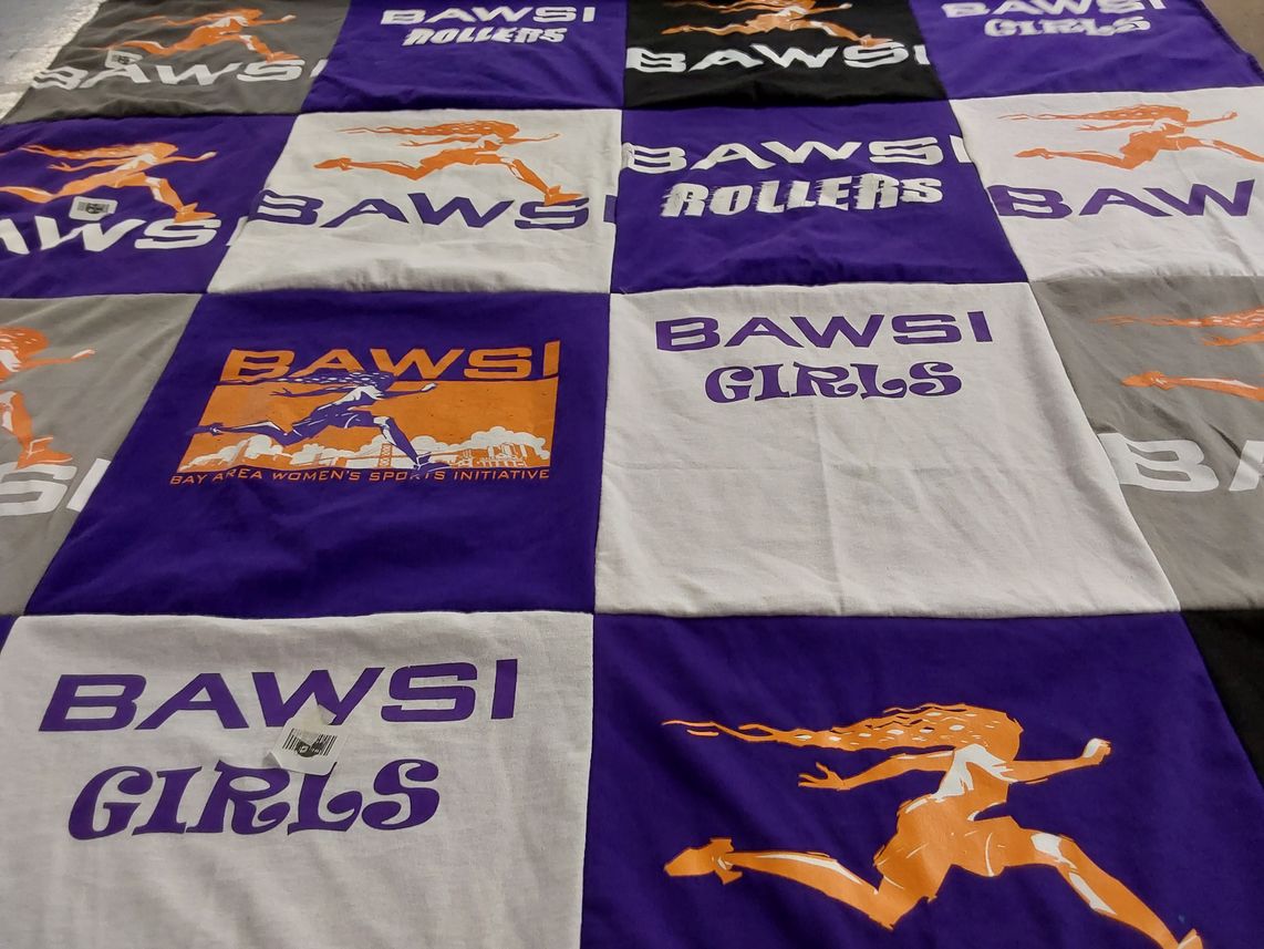 T-shirt quilt with sports, women's empowerment themes by Dana from CO