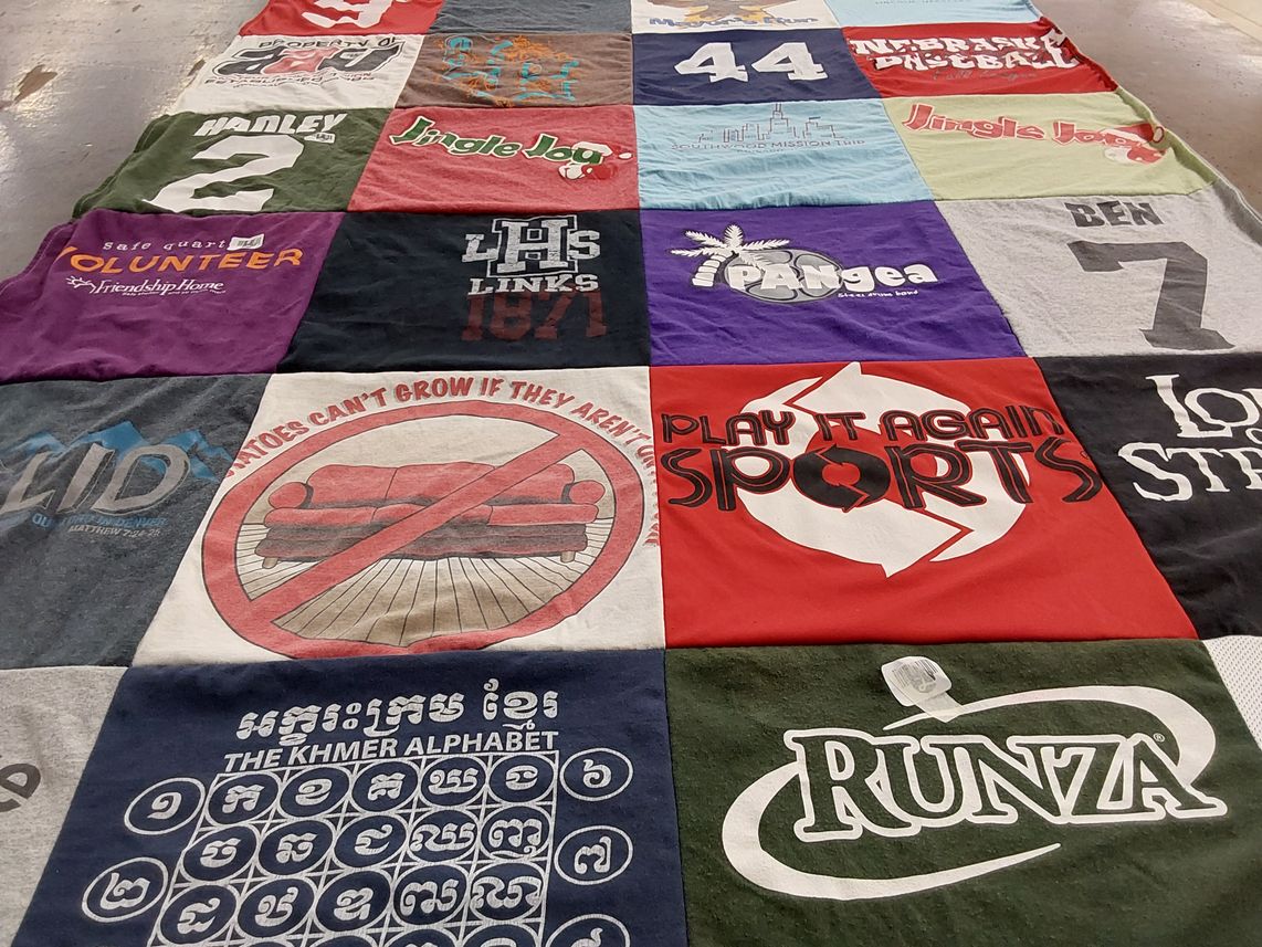 T-shirt quilt with volunteering, sports themes by Paul from NE
