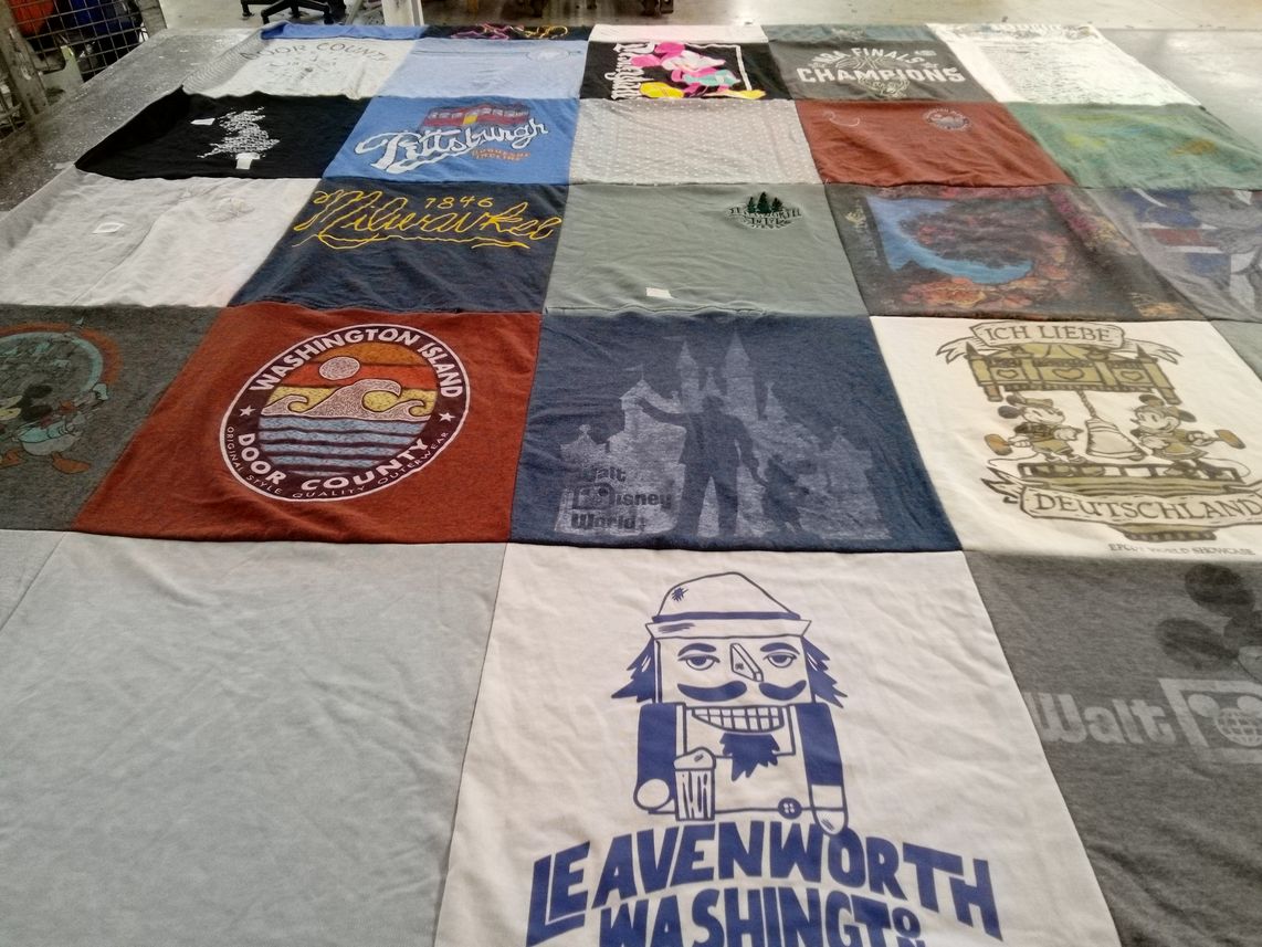 T-shirt quilt with travel, sports themes by Ann from WI