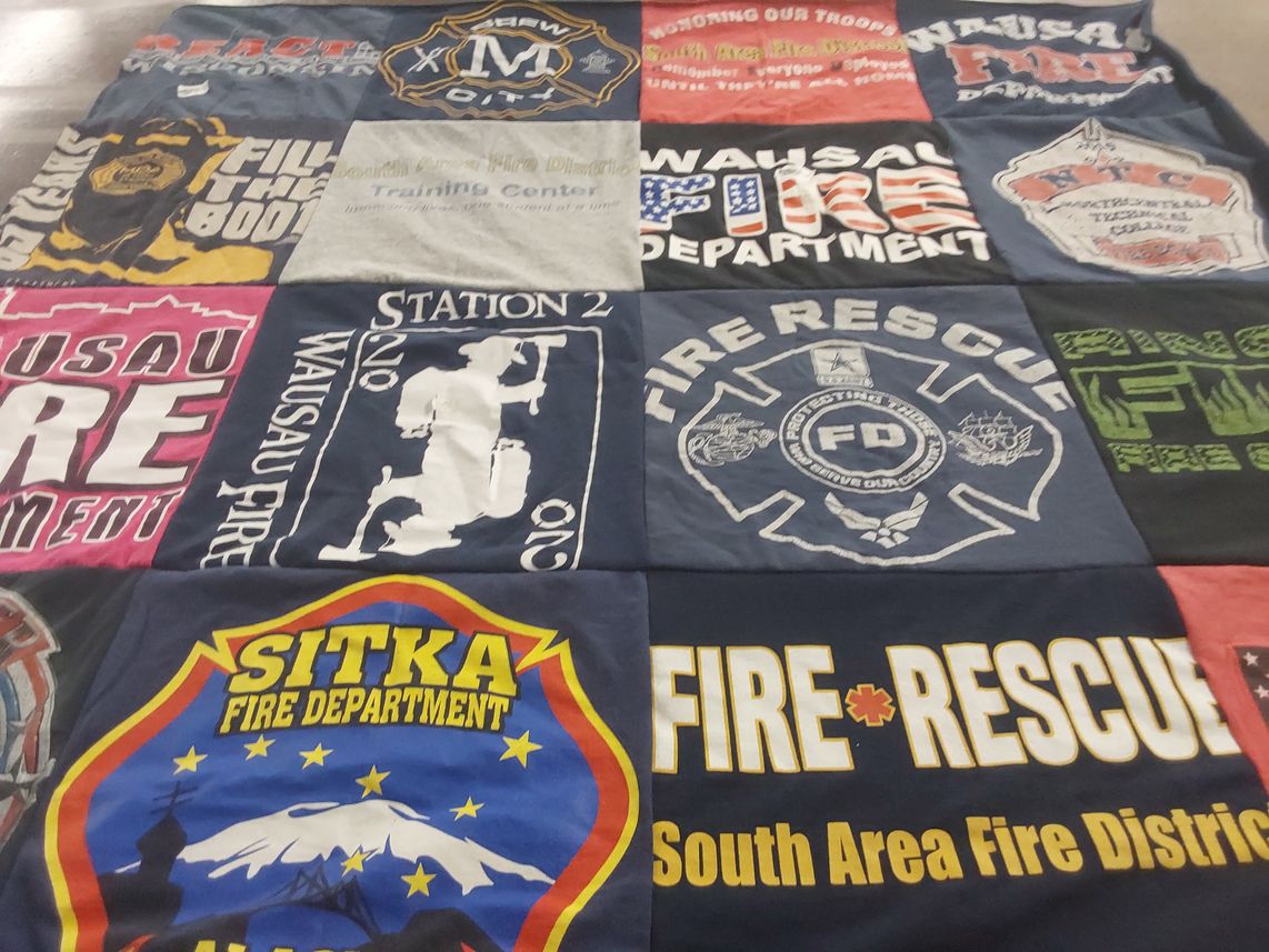 T-shirt quilt with firefighting, emergency services themes by Brittany from WI