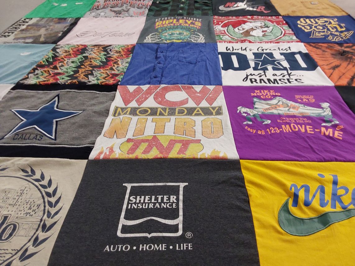 T-shirt quilt with sports, insurance themes by Shantel from OK