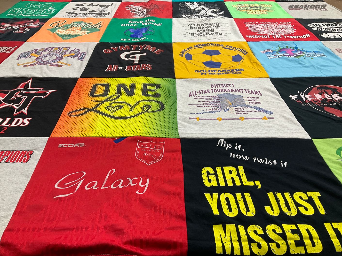 T-shirt quilt with soccer, athletics themes by Pat from FL