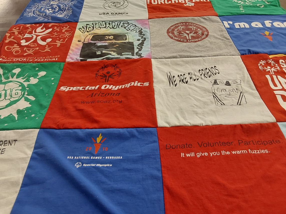 T-shirt quilt with community service, sports themes by Juan from AZ