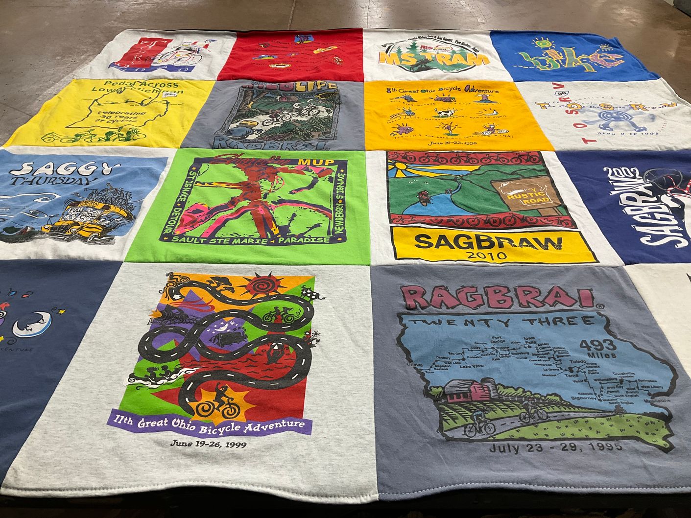 T-shirt quilt with cycling, bicycling themes by Ginnie from OH