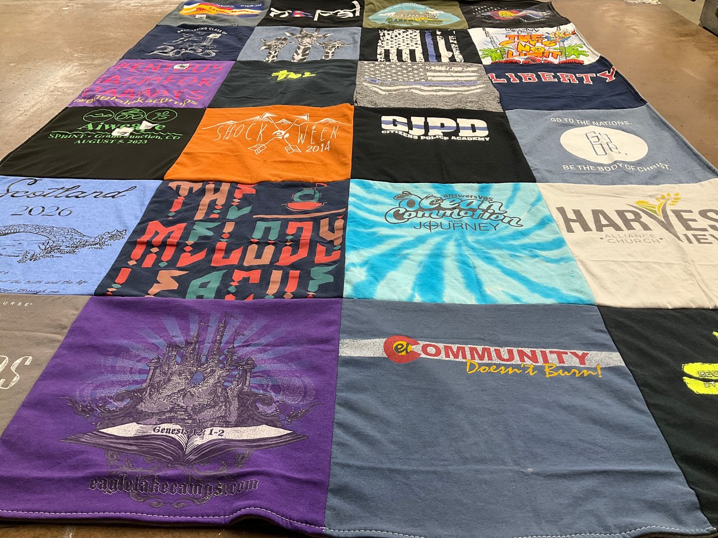 T-shirt quilt with travel, music themes by Kaitlyn from CO