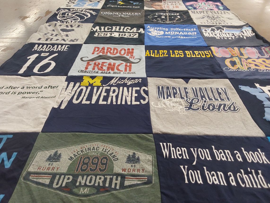 T-shirt quilt featuring michigan wolverines, maple valley lions by Margret from MI