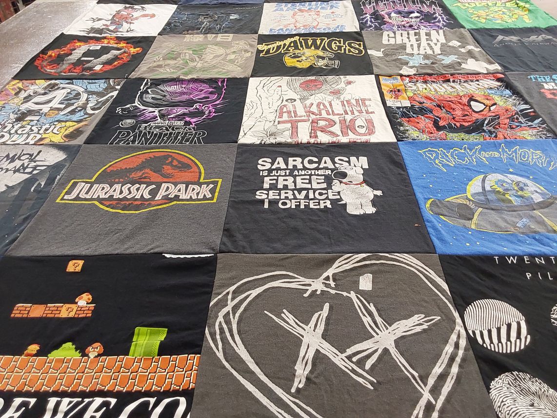 T-shirt quilt with music, movies themes by Leslie from CO