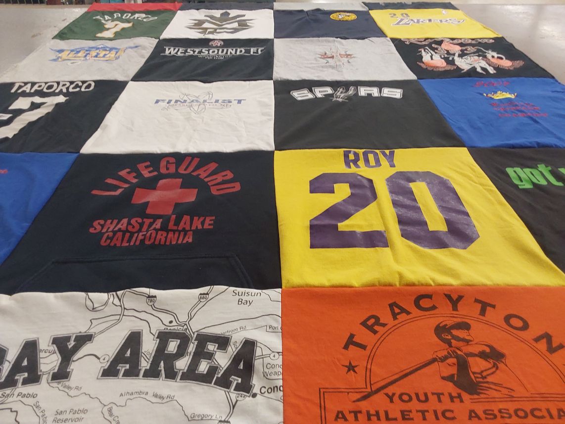 T-shirt quilt with athletics themes by Kim from WA
