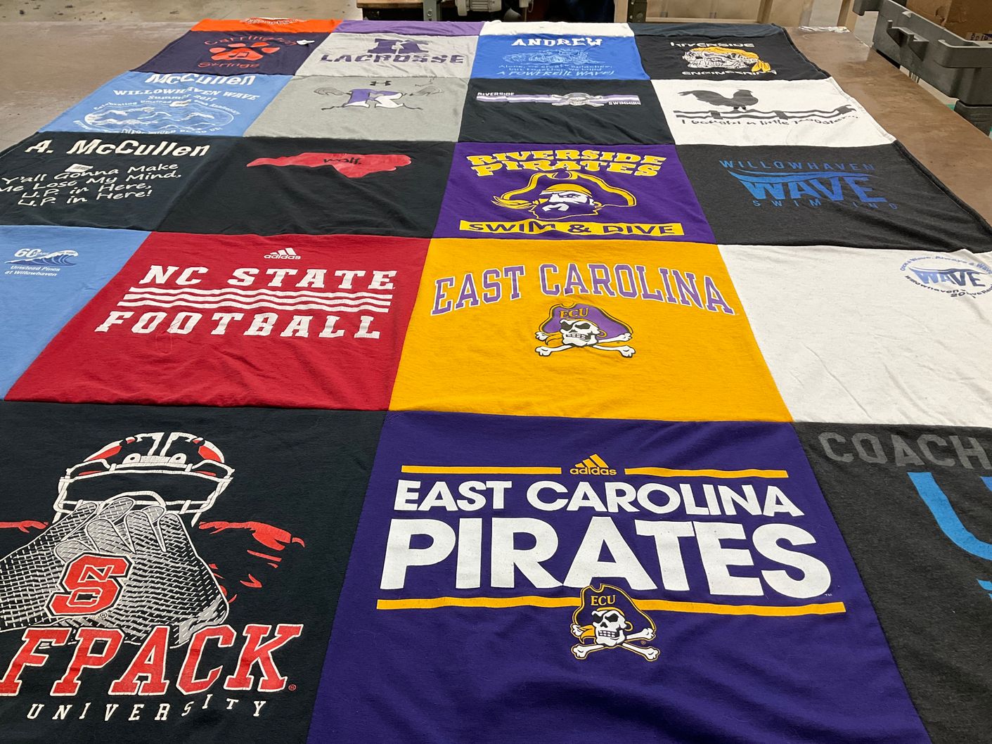 T-shirt quilt featuring nc state wolfpack, east carolina pirates by Kathryn from NC