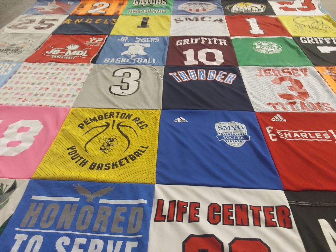 T-shirt quilt with basketball, soccer themes by Ann from MD