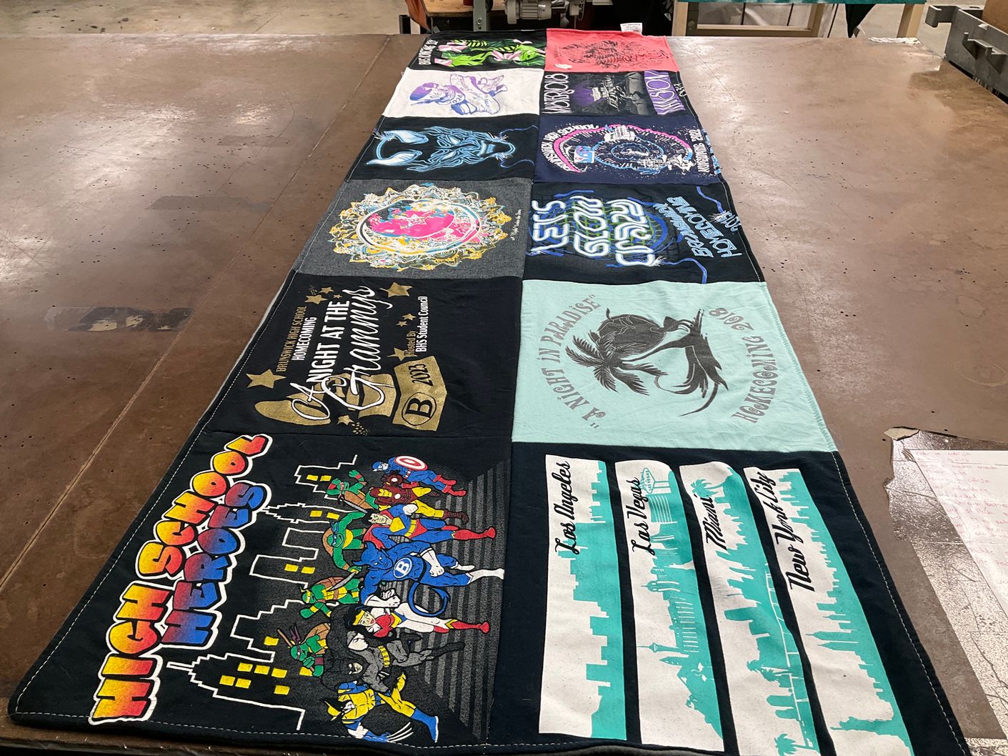 T-shirt quilt with superheroes, music themes by Megan from OH