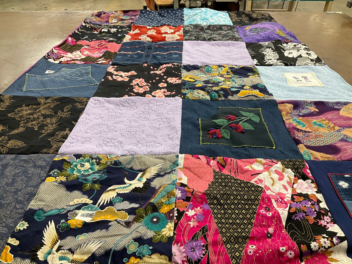 T-shirt quilt with quilting, textiles themes by Janine from HI
