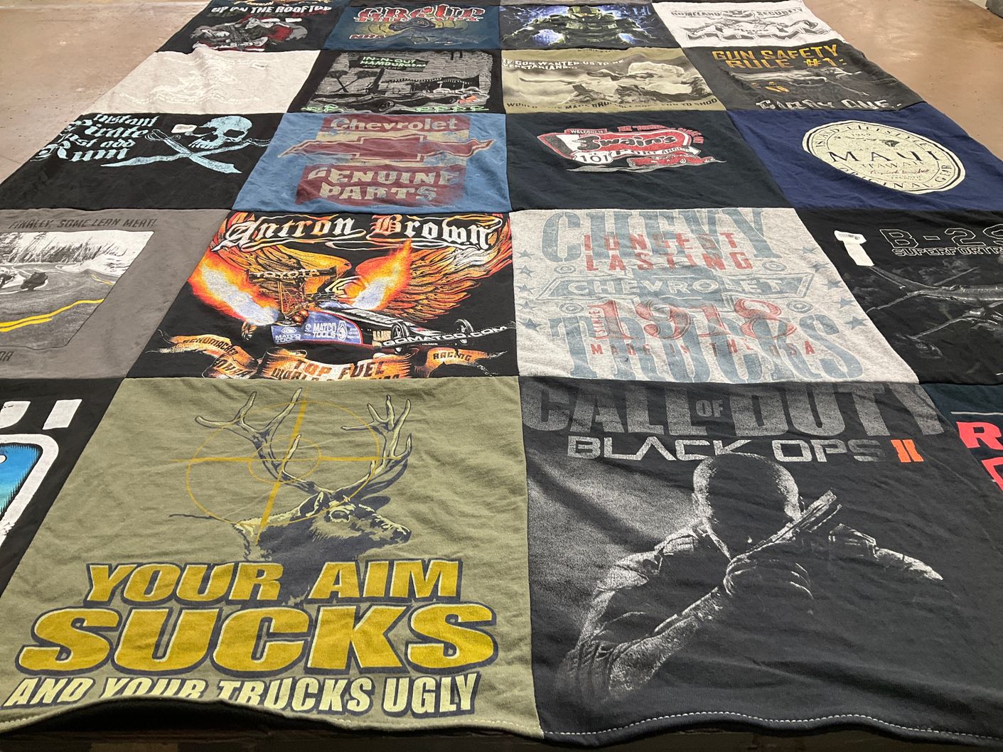 T-shirt quilt with vehicles, gaming themes by Kay from WA