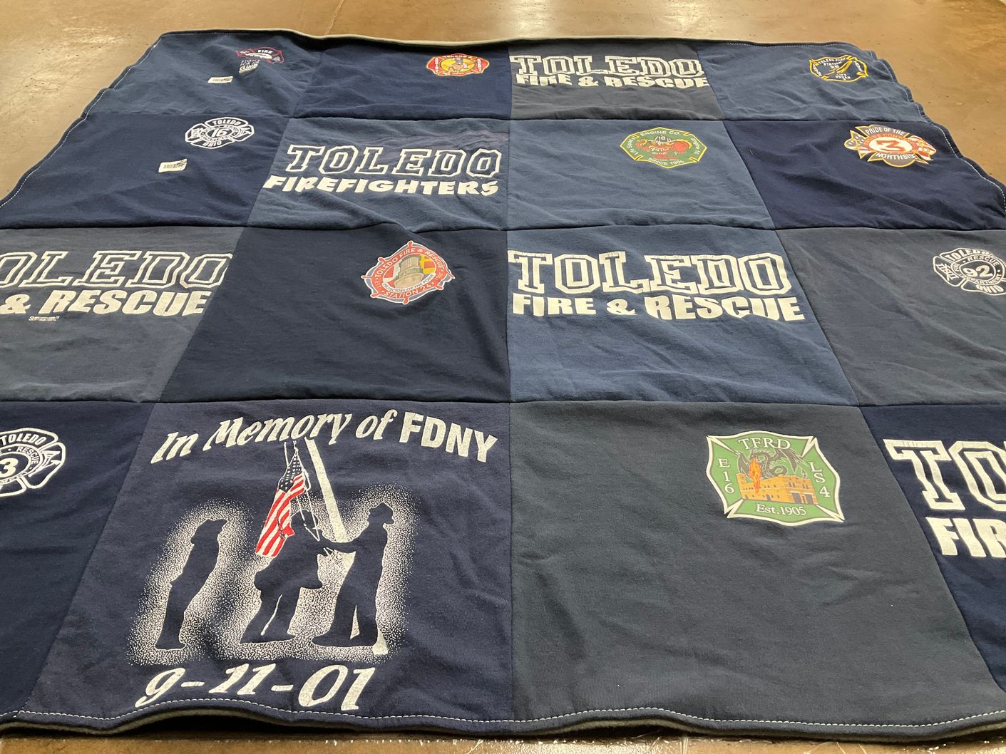 T-shirt quilt with firefighting, emergency services themes by Amy from OH
