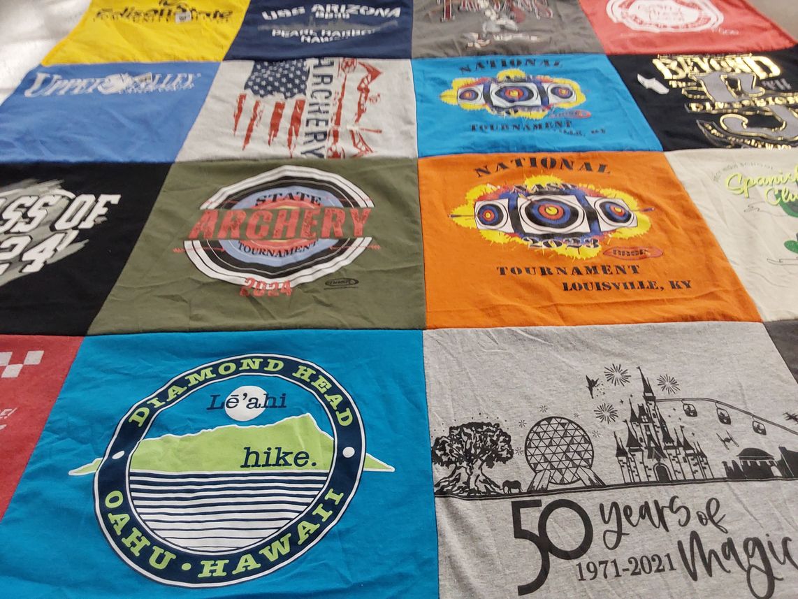 T-shirt quilt with archery, hiking themes by Angela from OH