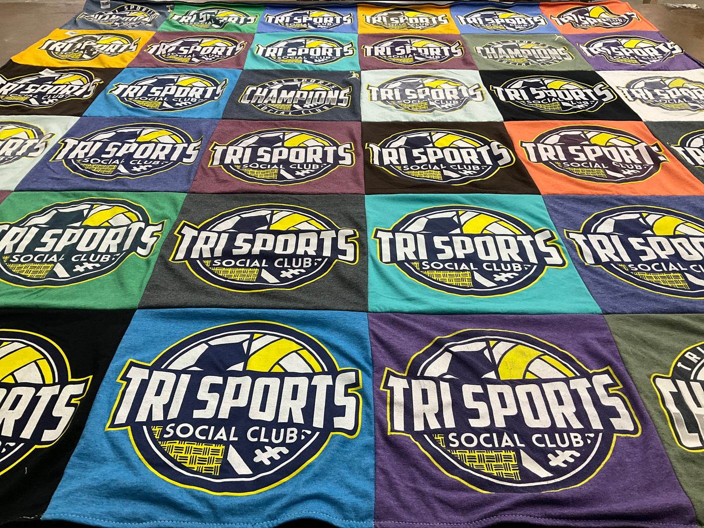 T-shirt quilt with sports themes by Laura from NC