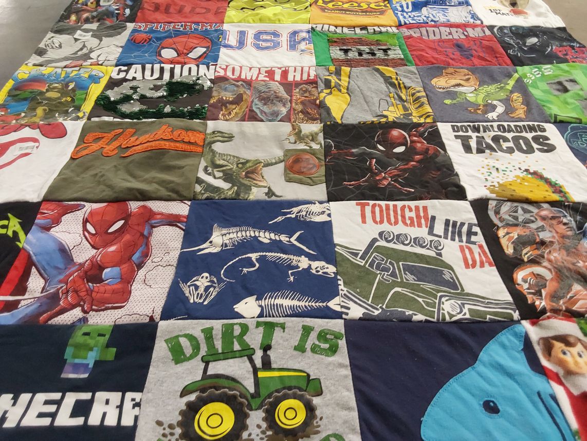 T-shirt quilt with superheroes, dinosaurs themes by Jennifer from PA