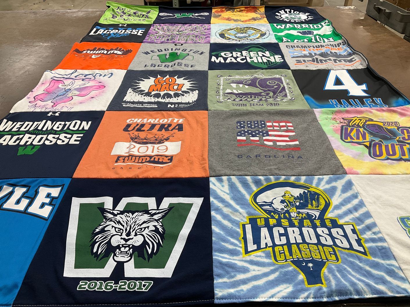 T-shirt quilt featuring weddington lacrosse, charlotte ultra swim team by Logan from NC