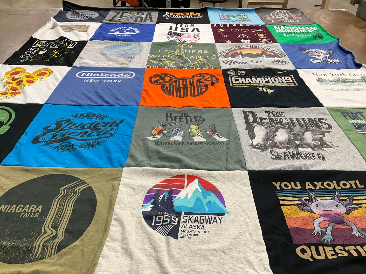 T-shirt quilt with video games, travel themes by Monica from FL