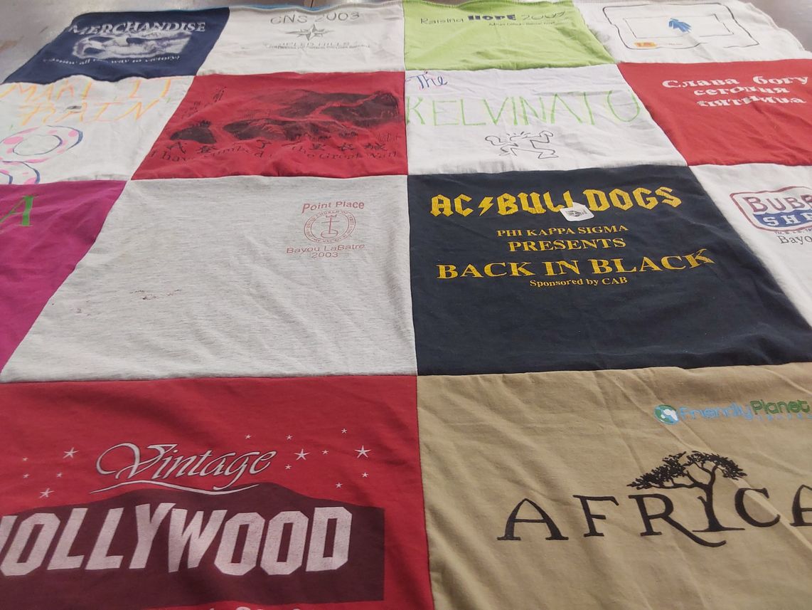 T-shirt quilt with travel, music themes by Lori from MI