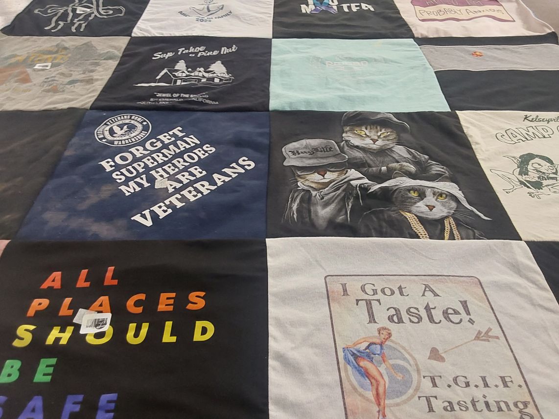 T-shirt quilt with veterans, safety themes by Dana from CA