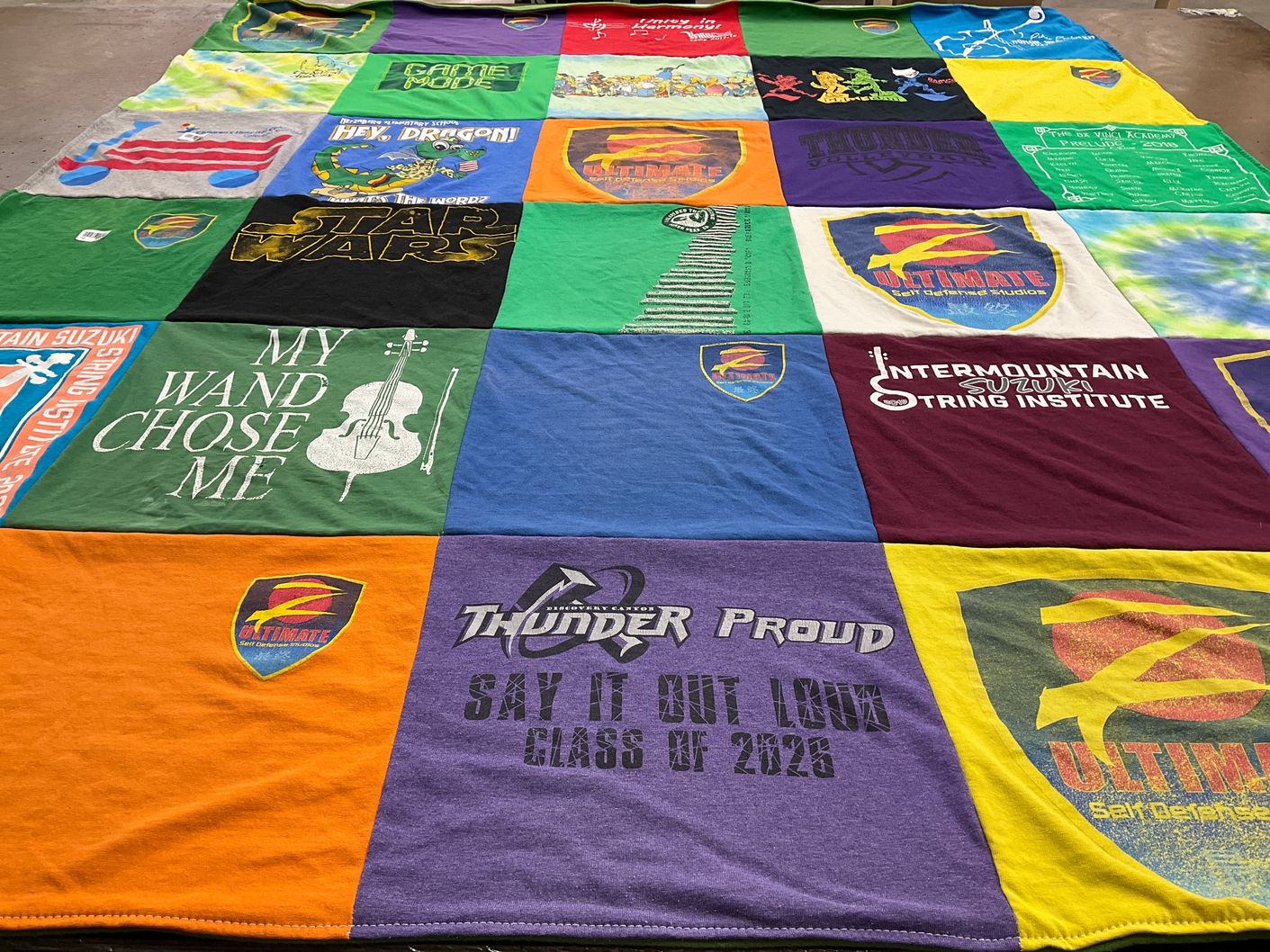 T-shirt quilt with music, ultimate frisbee themes by Briana from CO