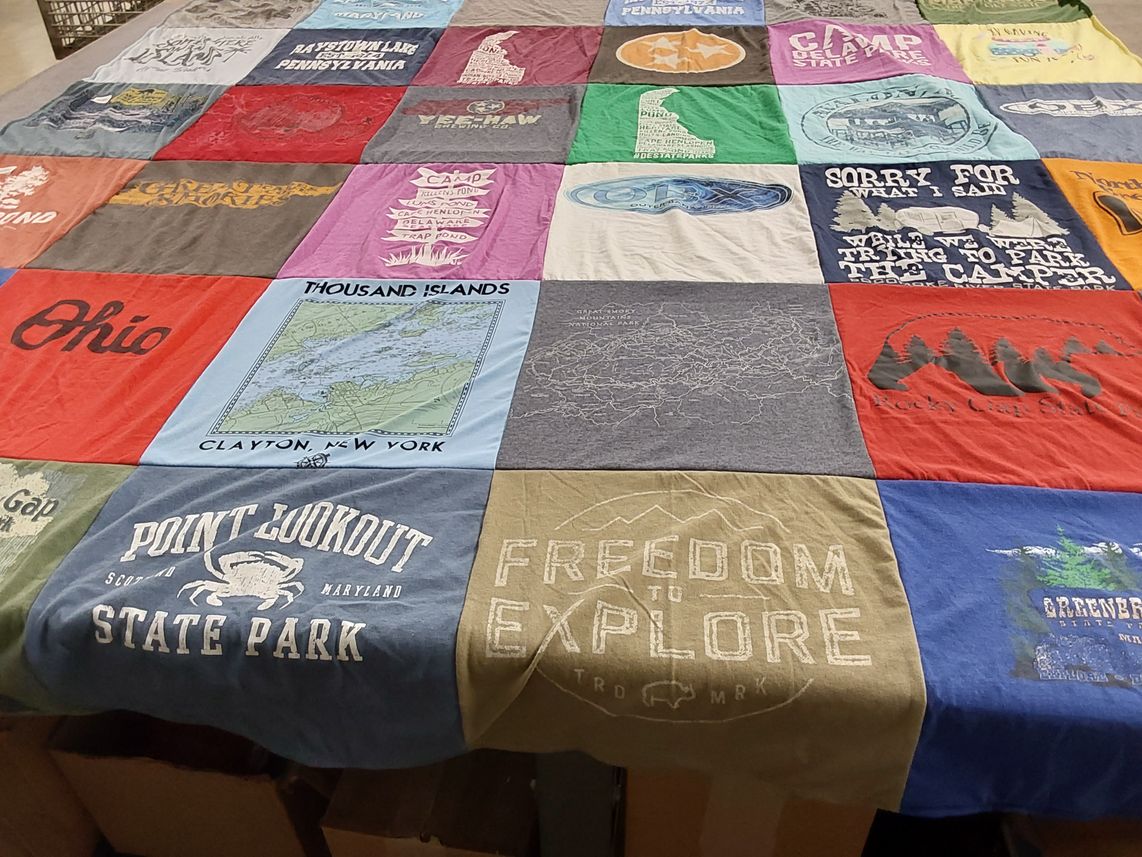 T-shirt quilt with outdoor, camping themes by Laure from MD