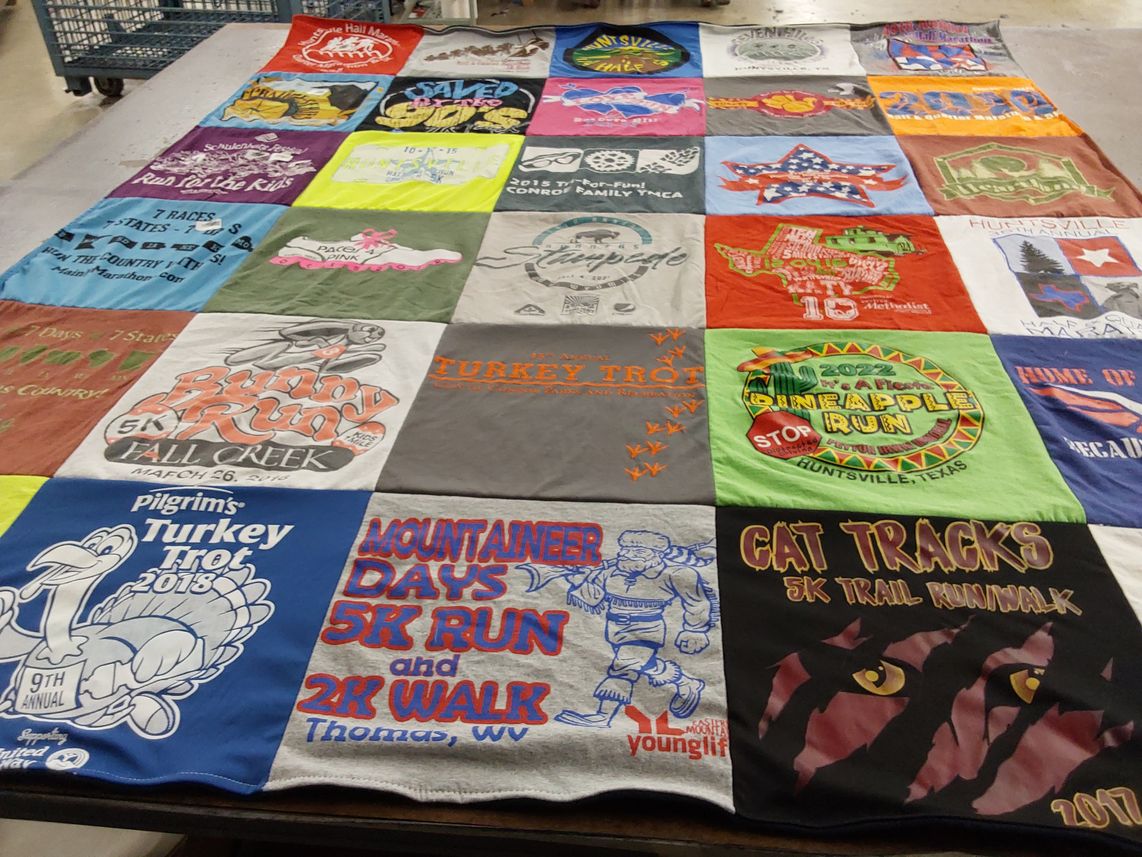 T-shirt quilt with running, charity events themes by Donna from TX