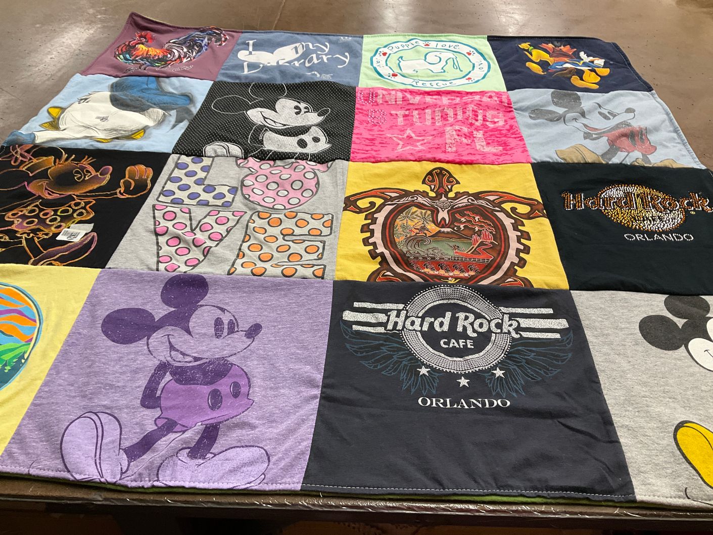 T-shirt quilt with disney, amusement parks themes by Laurel from NE