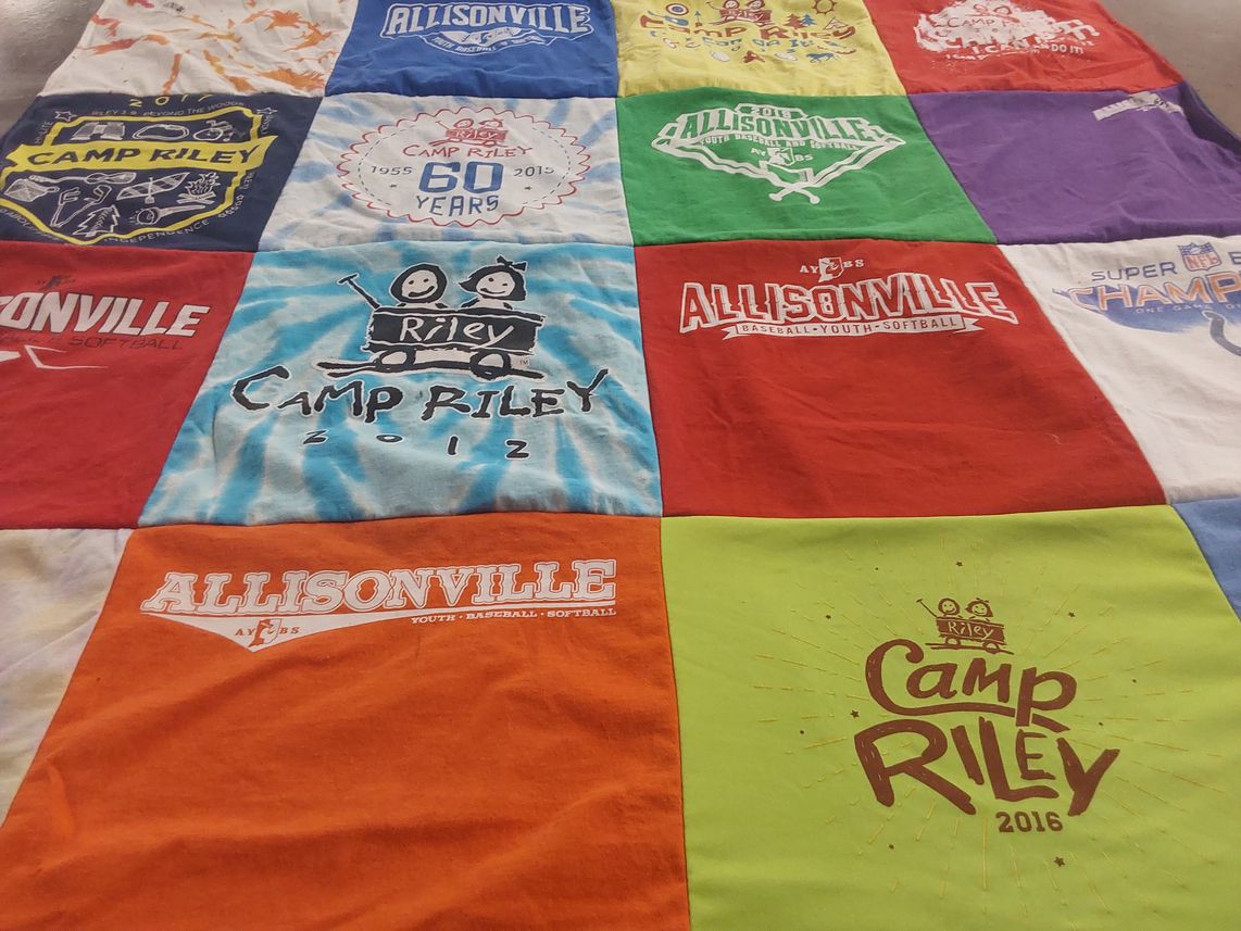 T-shirt quilt with youth sports, camping themes by Kathy from IN