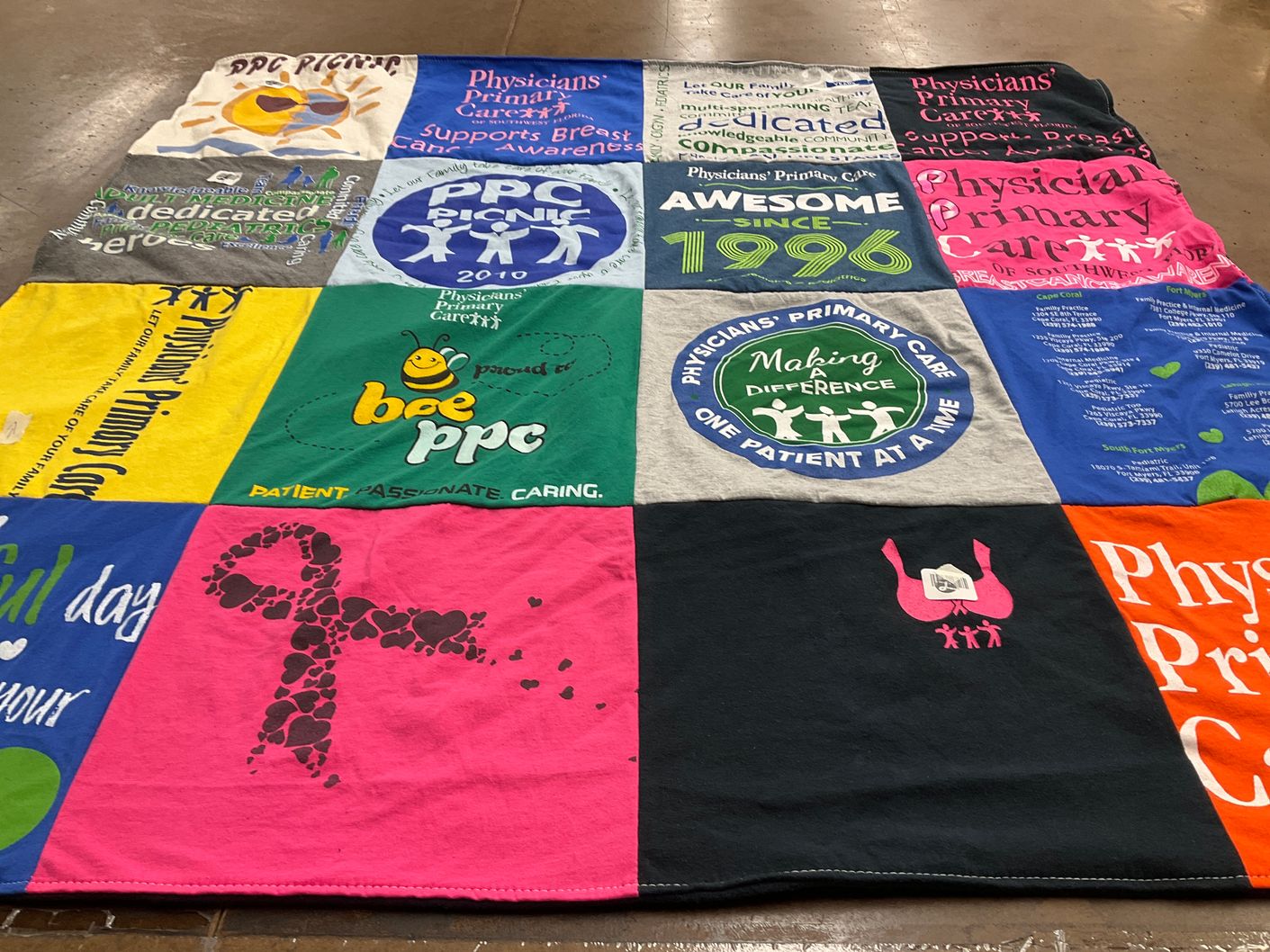 T-shirt quilt with healthcare, breast cancer awareness themes by Adrienne from FL
