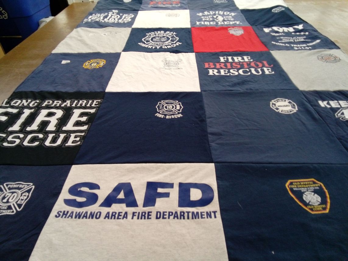 T-shirt quilt with firefighting, emergency services themes by Liz from WI