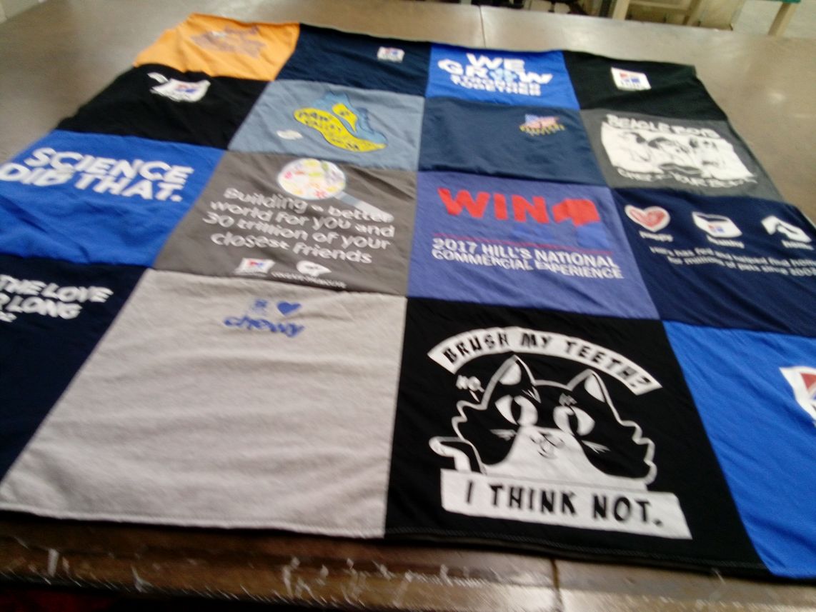 T-shirt quilt with science, community themes by Megan from KS