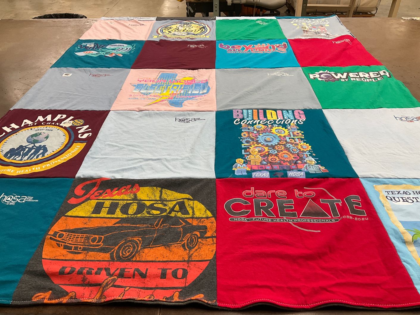 T-shirt quilt with healthcare, education themes by Maria from TX