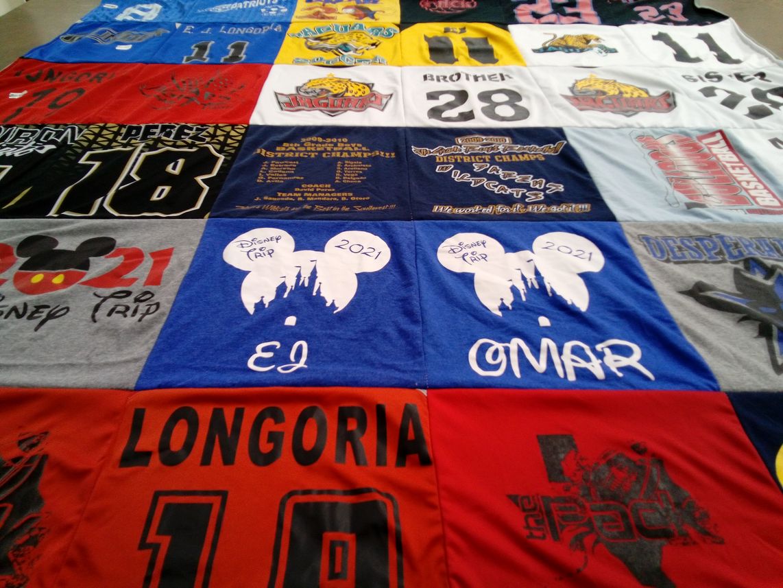 T-shirt quilt with disney, sports themes by Jessica from TX
