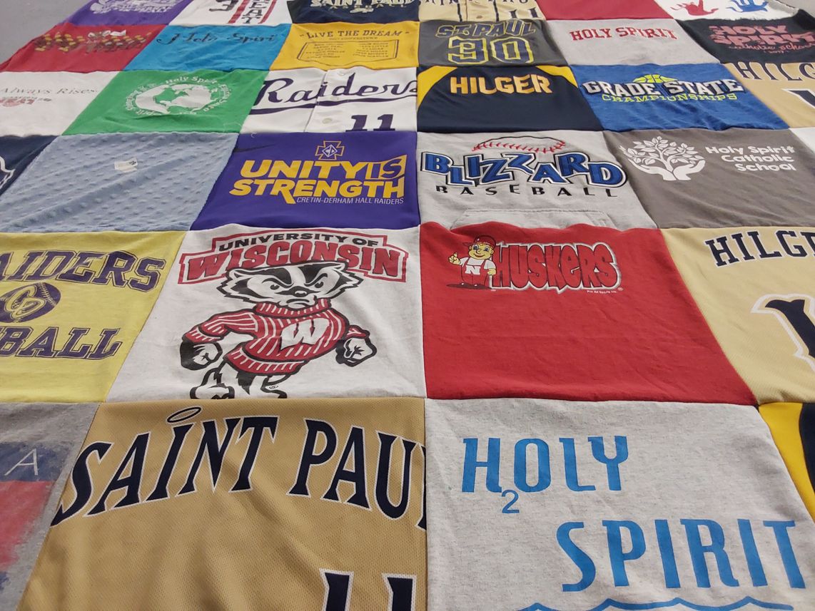 T-shirt quilt featuring raiders, nebraska huskers by Leanne from MN