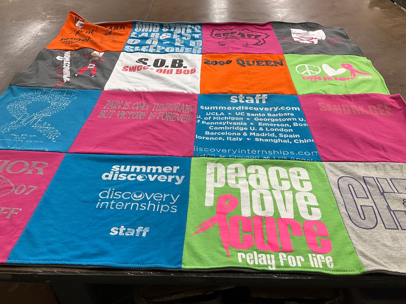T-shirt quilt with camping, cancer awareness themes by Emma from OH