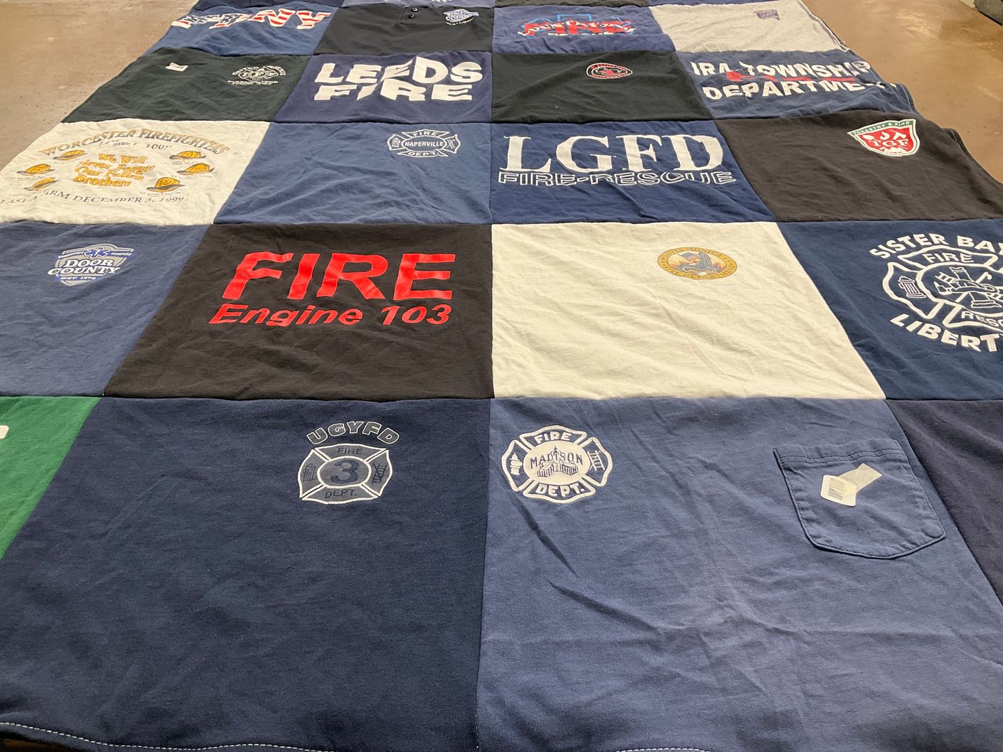 T-shirt quilt with firefighting, emergency services themes by Liz from WI