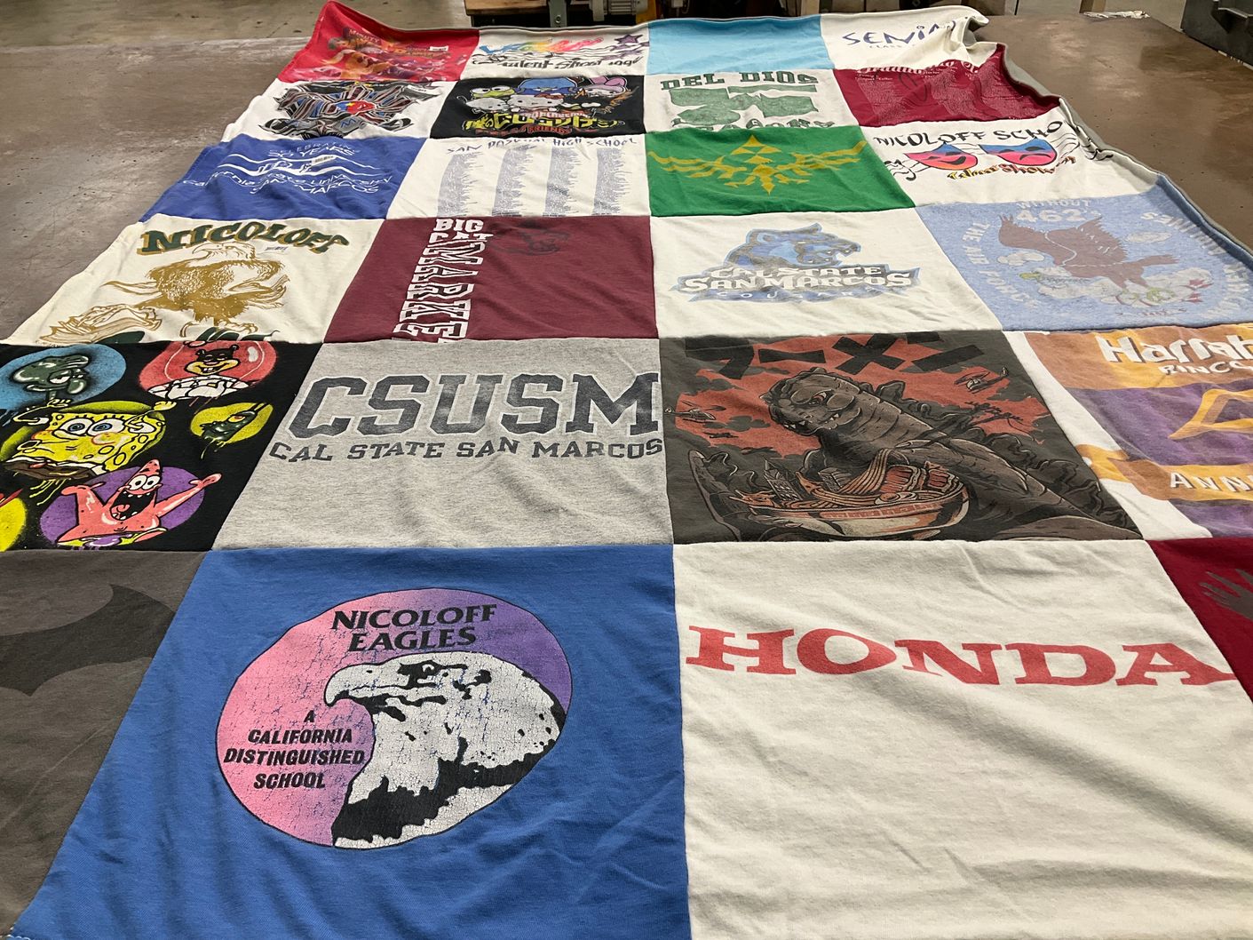 T-shirt quilt from cal state san marcos university, nicoloff school by Camille from CA