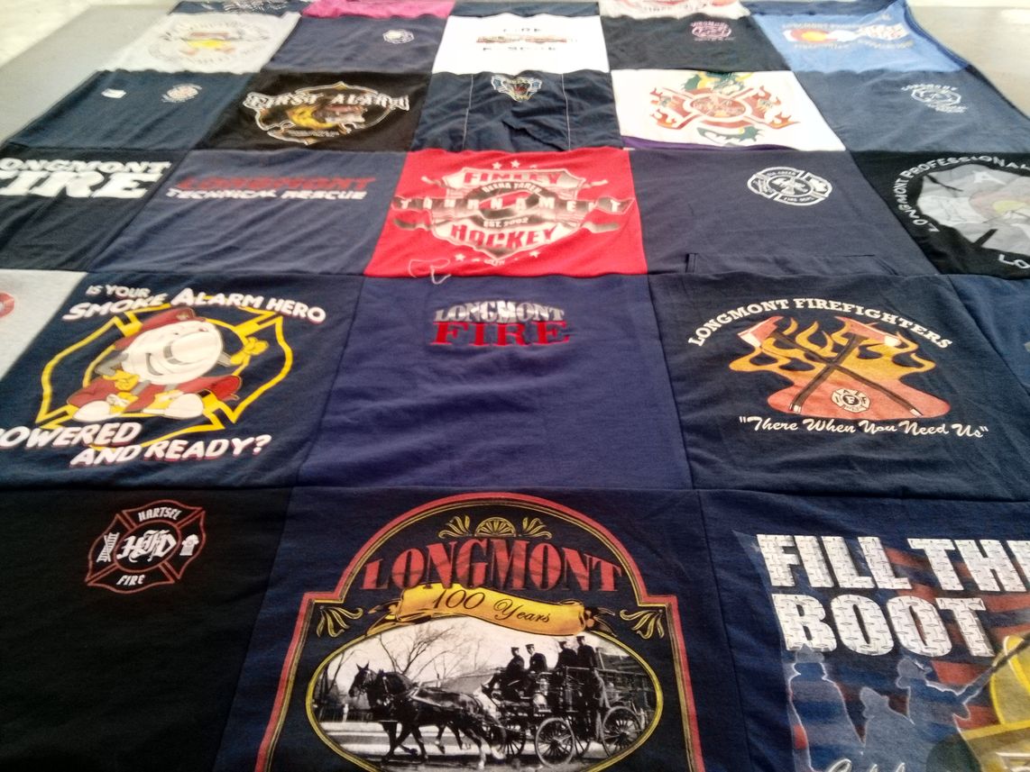 T-shirt quilt with firefighting, community service themes by Michelle from CO
