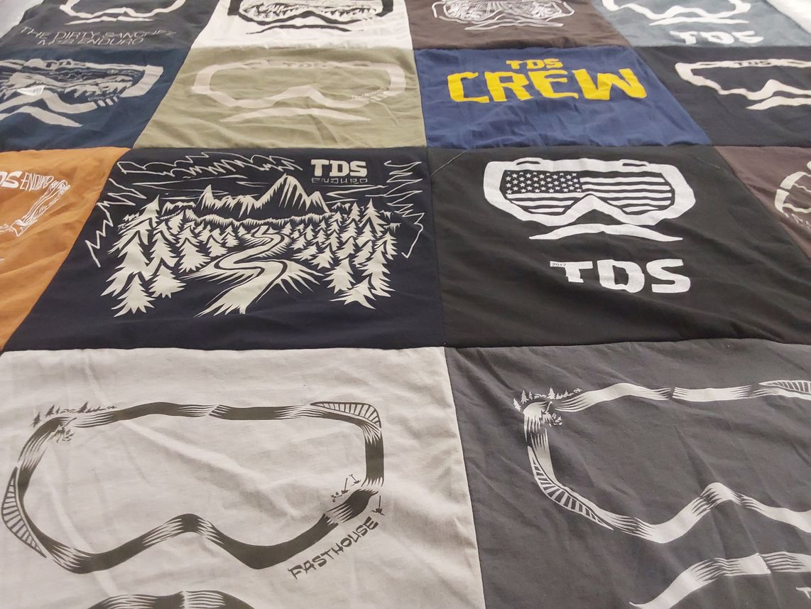 T-shirt quilt with mountain biking, enduro racing themes by Debbie from CA
