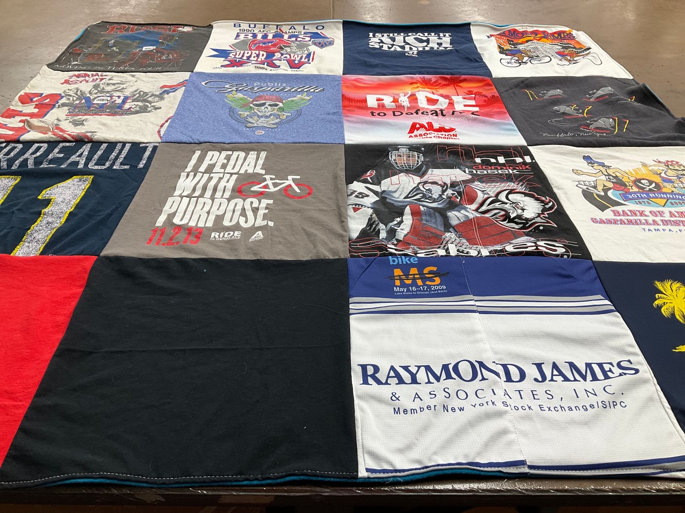T-shirt quilt with cycling, sports themes by Susan from NY