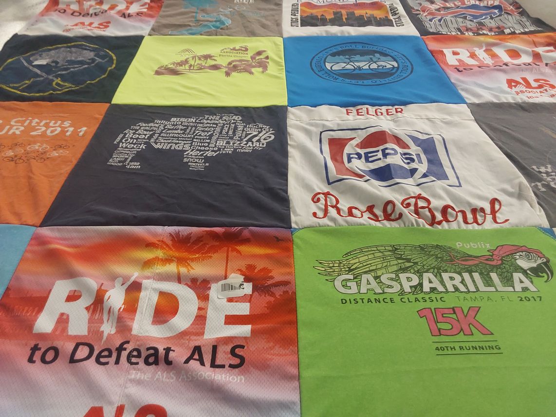 T-shirt quilt with cycling, running themes by Susan from NY