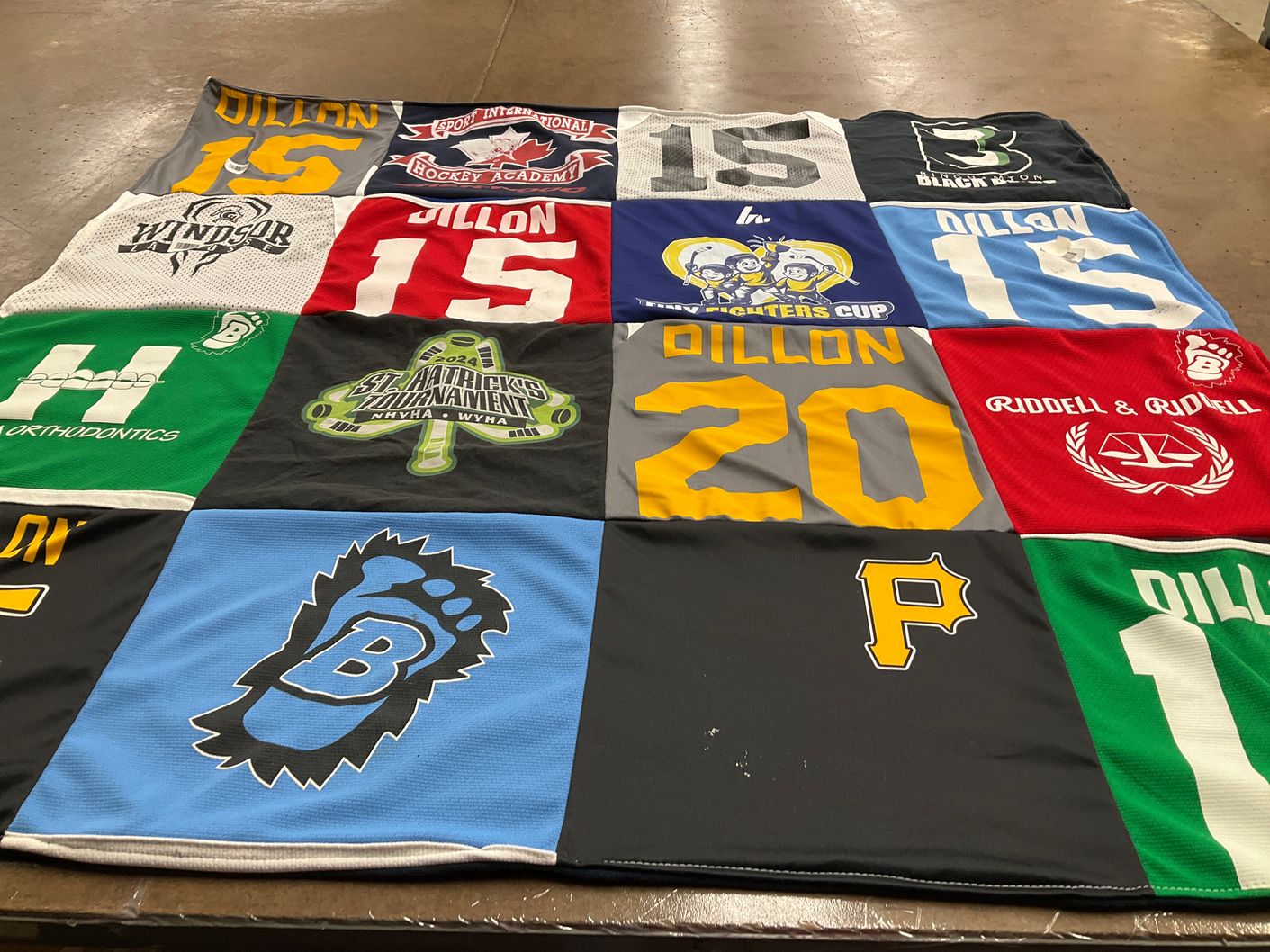 T-shirt quilt with hockey, sports themes by Julie from NY