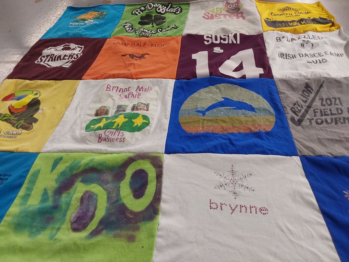 T-shirt quilt with dance, camping themes by Emily from PA