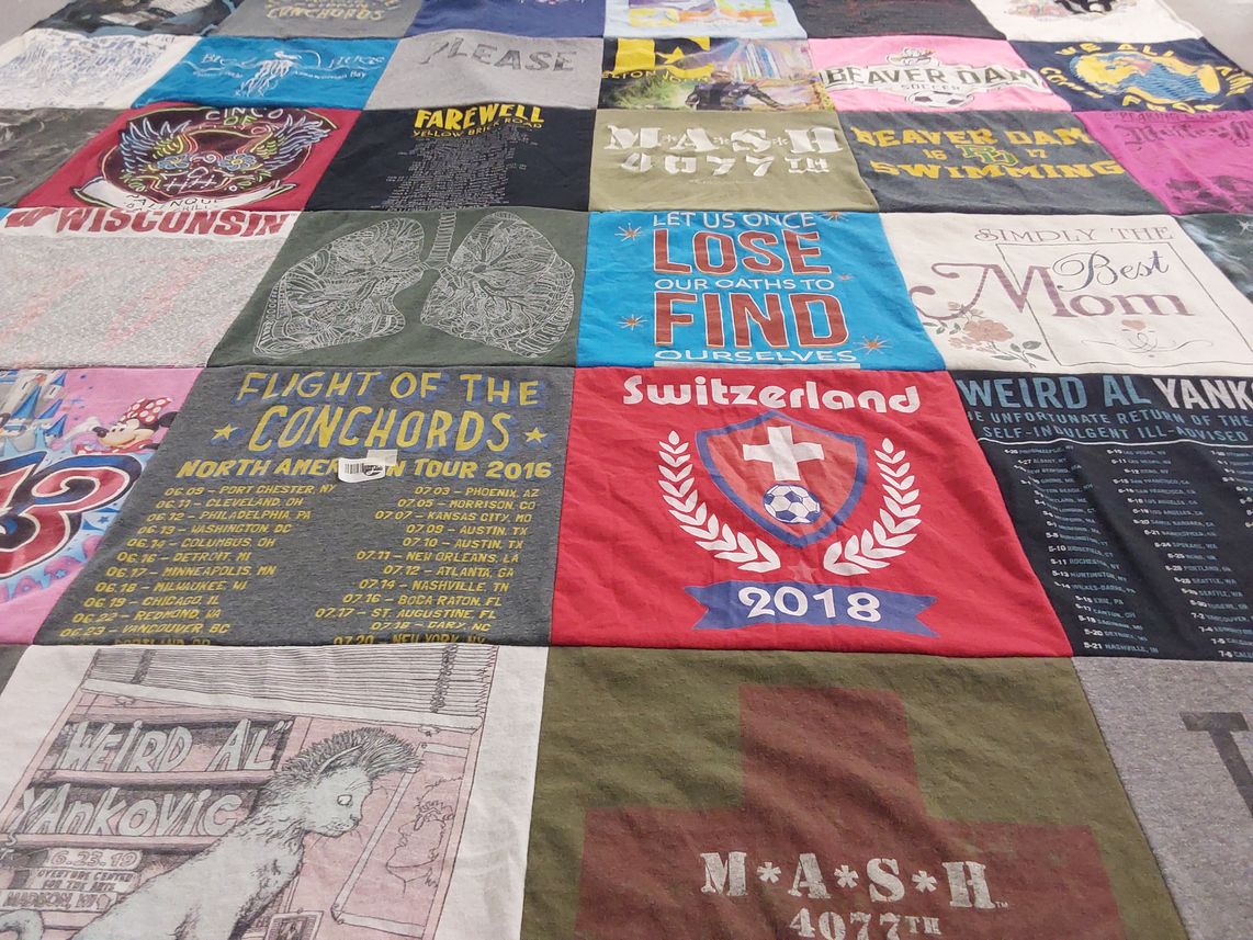 T-shirt quilt with music, comedy themes by Dionette from WI
