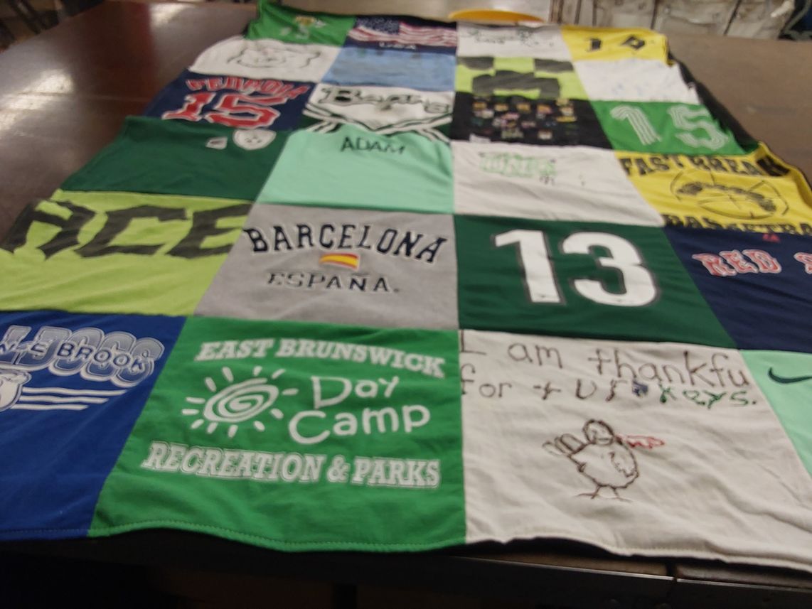 T-shirt quilt with sports, travel themes by Sandra from NJ
