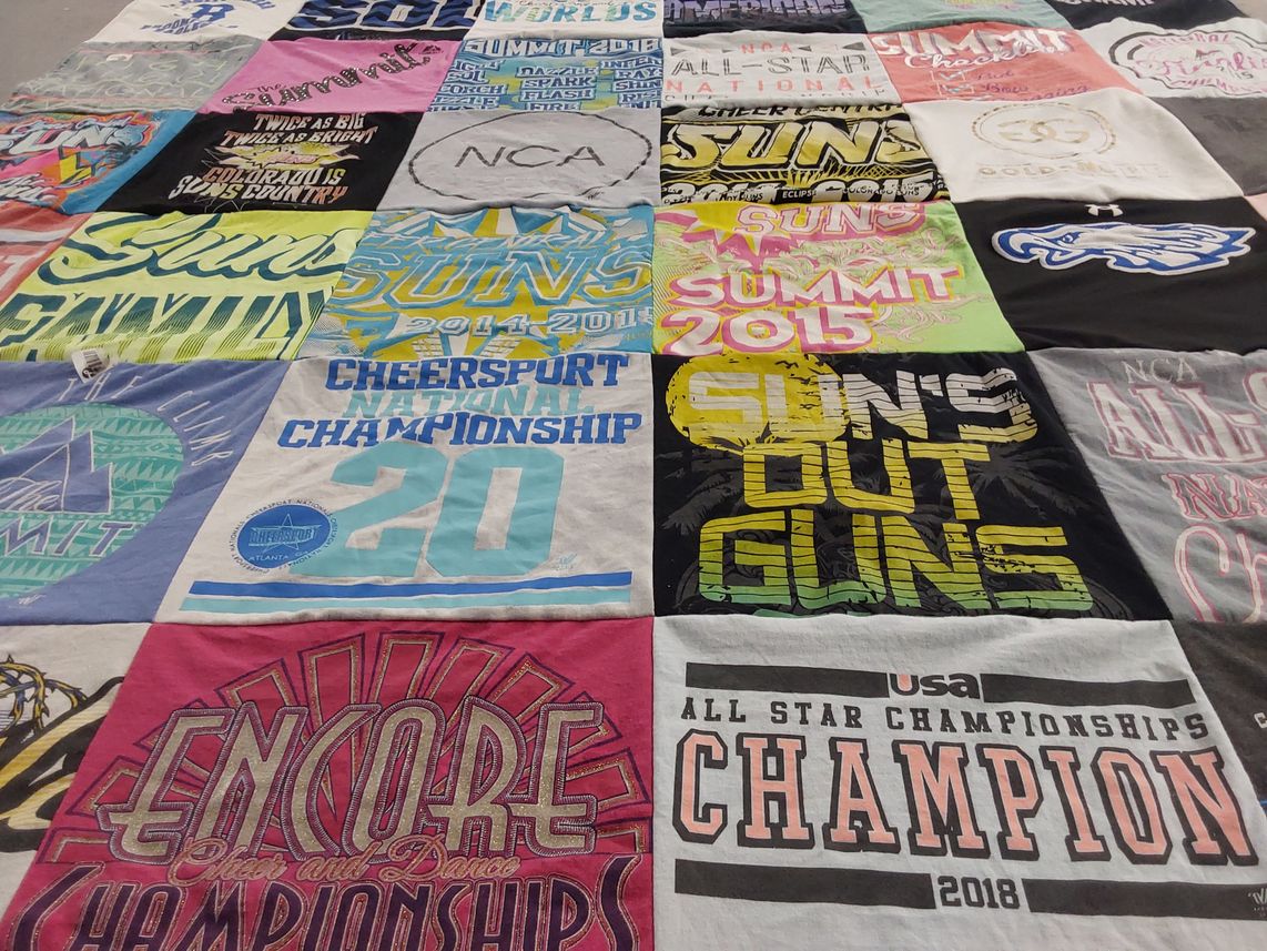 T-shirt quilt with cheerleading, dance themes by Kim from CO